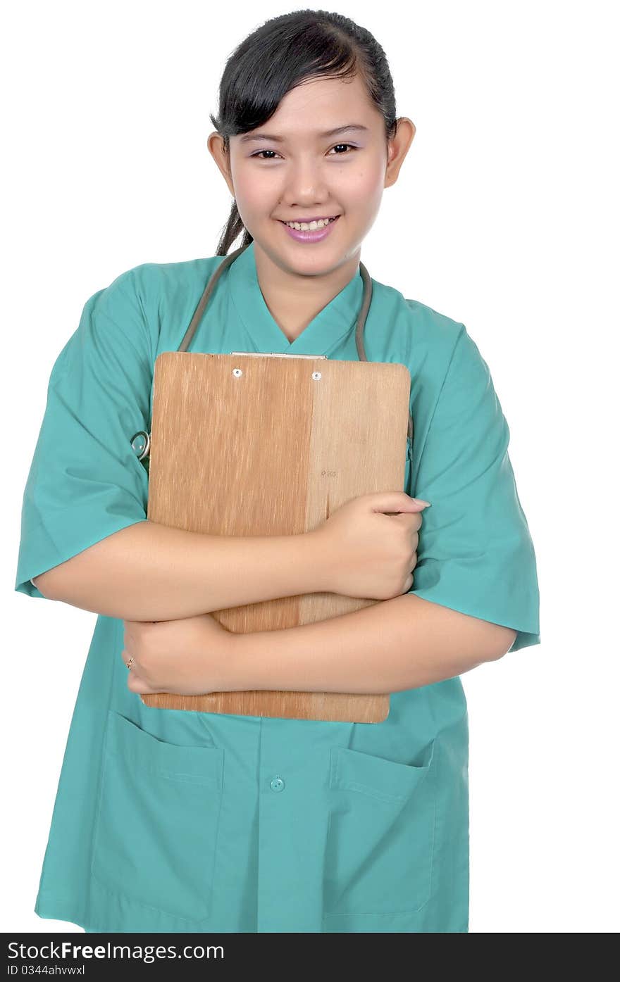 A Doctor wearing scrub hold paperboard isolated over white background. A Doctor wearing scrub hold paperboard isolated over white background