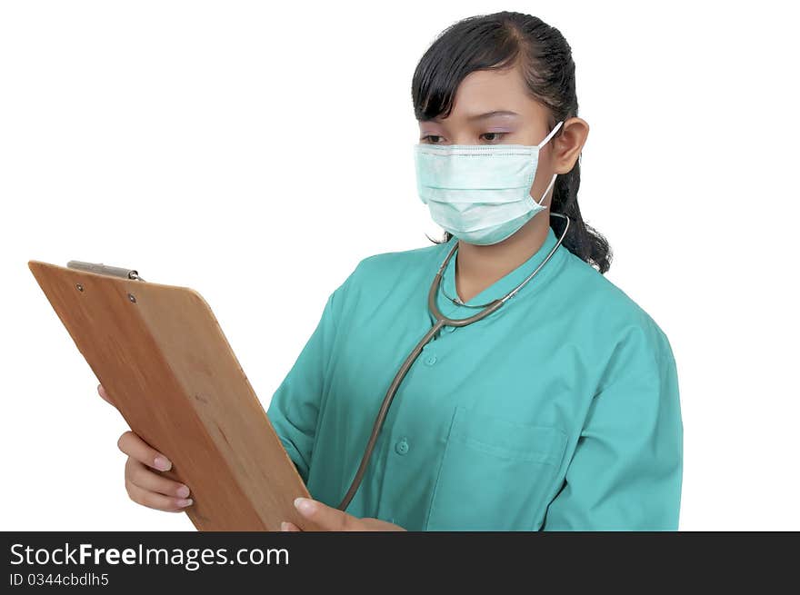 A Doctor wearing scrub hold paperboard isolated over white background. A Doctor wearing scrub hold paperboard isolated over white background