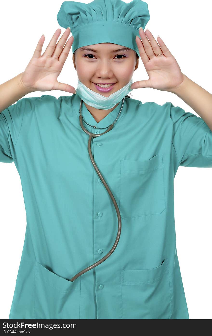 A Doctor wearing scrub , framing her face isolated over white background. A Doctor wearing scrub , framing her face isolated over white background