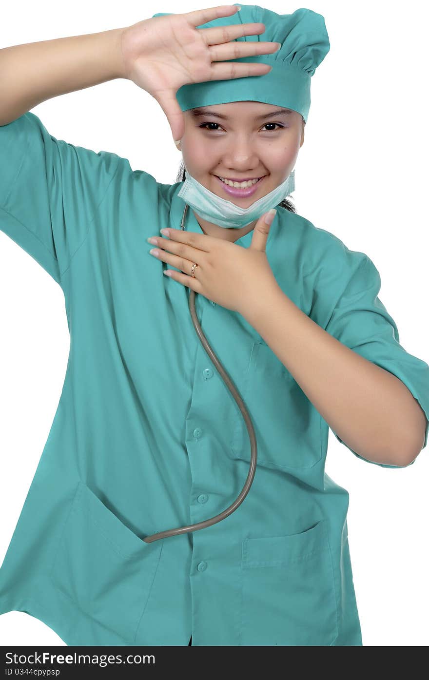 A Doctor wearing scrub , framing her face isolated over white background. A Doctor wearing scrub , framing her face isolated over white background