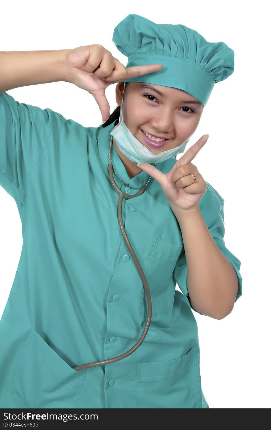 A Doctor wearing scrub , framing her face isolated over white background. A Doctor wearing scrub , framing her face isolated over white background