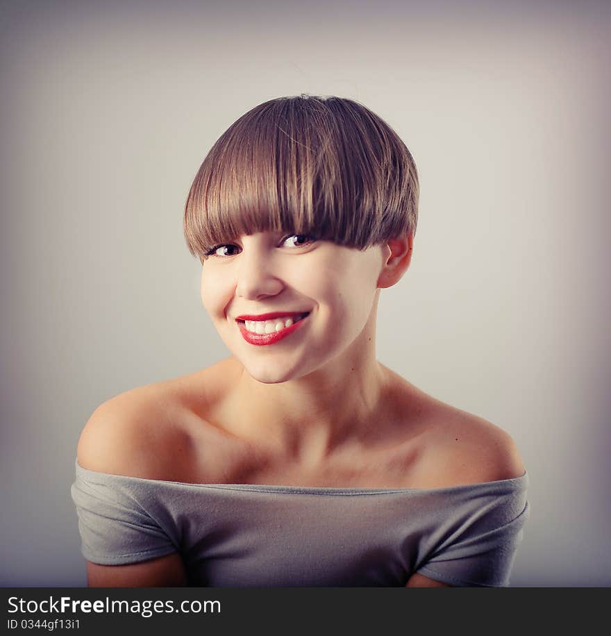 Smiling young girl with creative hairstyle