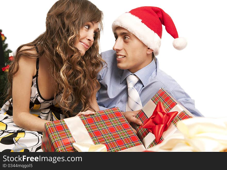 Young lovely couple with gift boxes. Isolated over white background