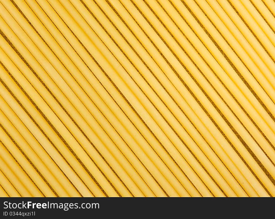 Raw spaghetti on the burlap background