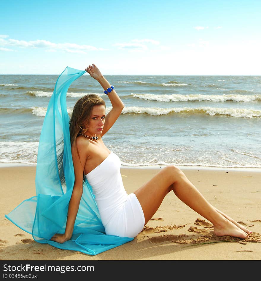 Woman laying on sand sea on background. Woman laying on sand sea on background