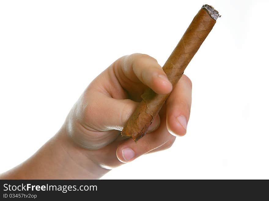 The man's hand holds fingers a cigaret on a white background. The man's hand holds fingers a cigaret on a white background