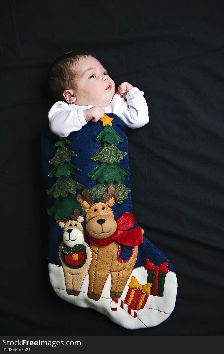 Portrait with little baby girl in Santa's shoe