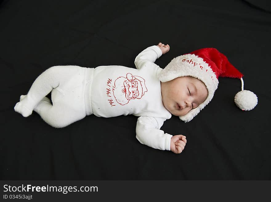 Portrait with little Santa Claus sleeping