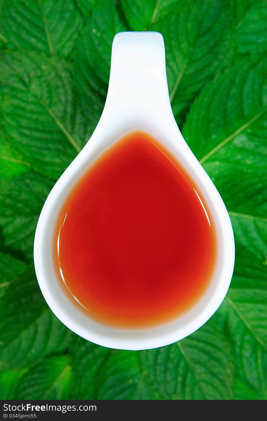 Tea with green leaves on a white background an ideal drink and healthy food