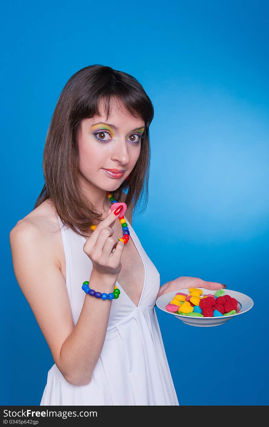 Portrait of beautiful girl holding candies in hands. Portrait of beautiful girl holding candies in hands