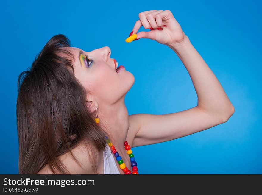 Portrait of beautiful girl with a candy in a hand. Portrait of beautiful girl with a candy in a hand