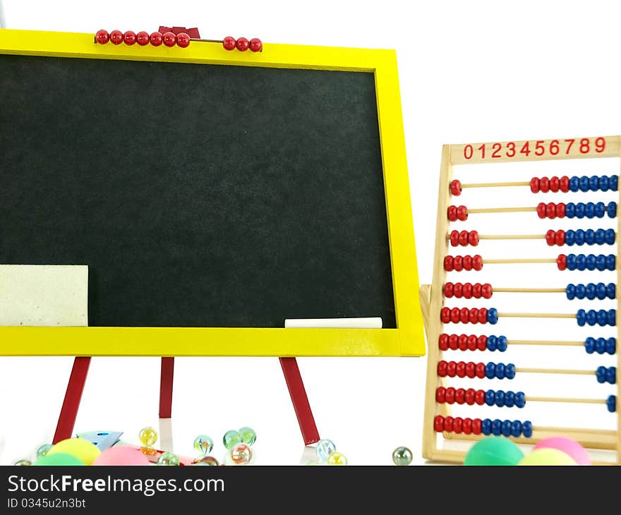 Colorful blackboard with abacus and marbles