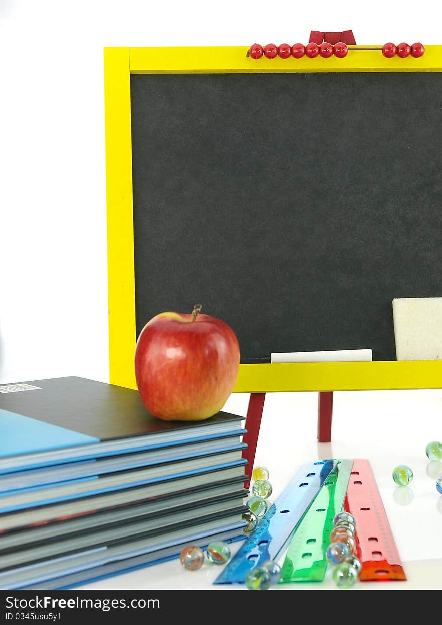 Blackboard with books and apple. Blackboard with books and apple