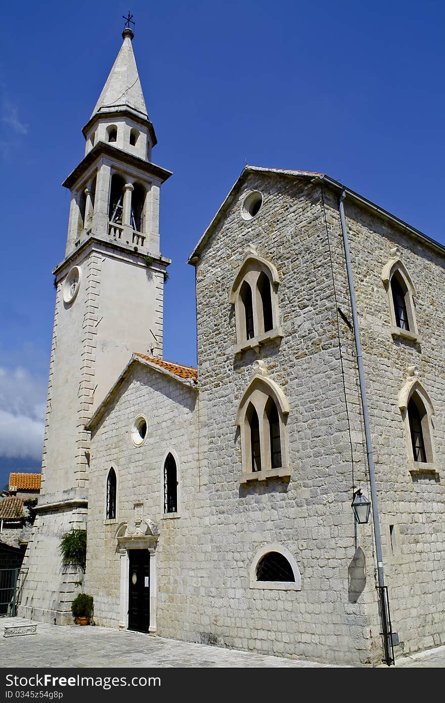 An ancient stone cathedral against the blue sky