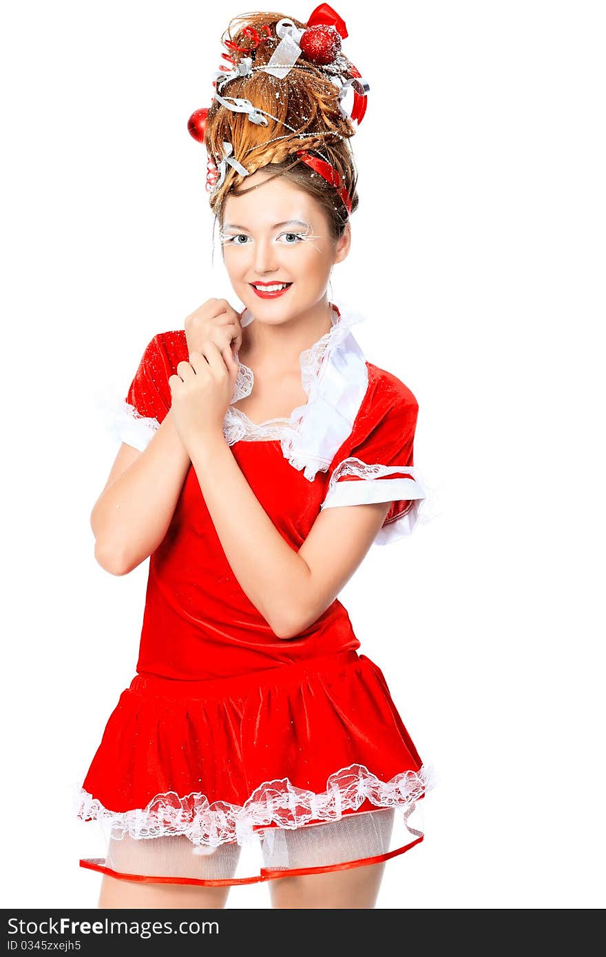 Beautiful young woman in Santa Claus clothes, isolated over white background. Beautiful young woman in Santa Claus clothes, isolated over white background.