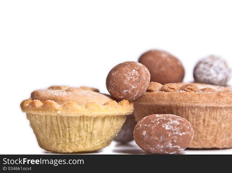 Mince pies and chocolate eggs isolated on white background