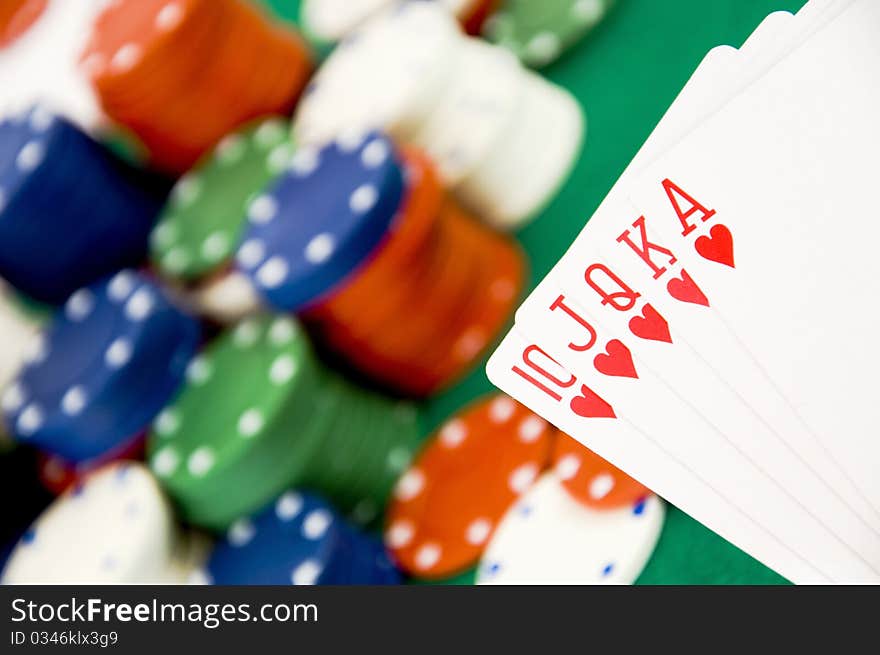 Heart poker with lot of casino gambling chips in background