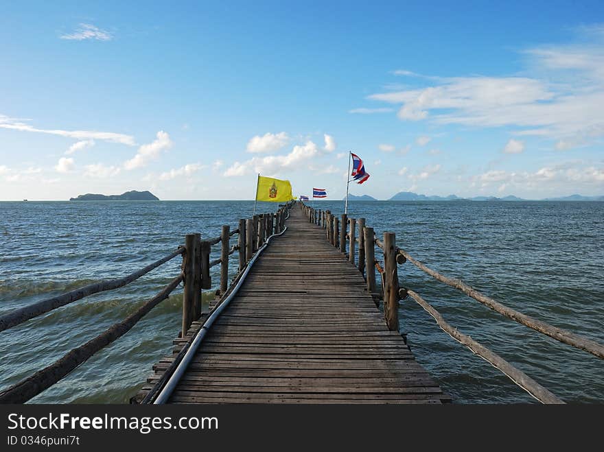 Ferry Bridge In The Sea With Flags