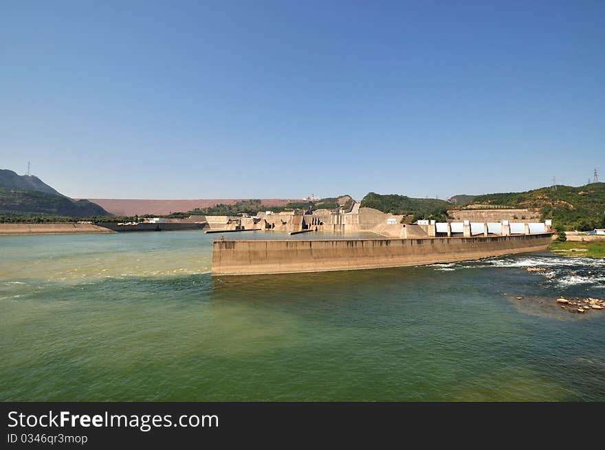 Wide angle of water electricity plant on yellow river in China, as big construction made by concrete built beside yellow river. Wide angle of water electricity plant on yellow river in China, as big construction made by concrete built beside yellow river.