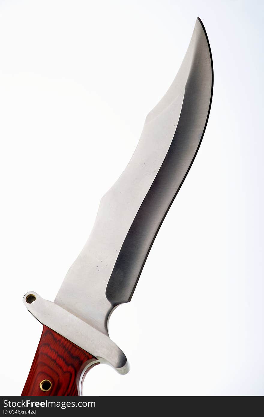 Hunting knife with wooden handle on a white background. Hunting knife with wooden handle on a white background