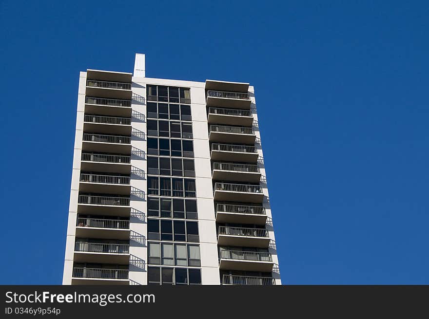 Skyscraper residential building on a clear blue sky. Skyscraper residential building on a clear blue sky.