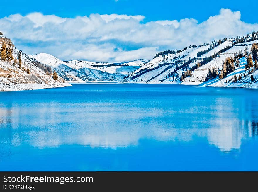 Lake in the snow covered mountains. Lake in the snow covered mountains.