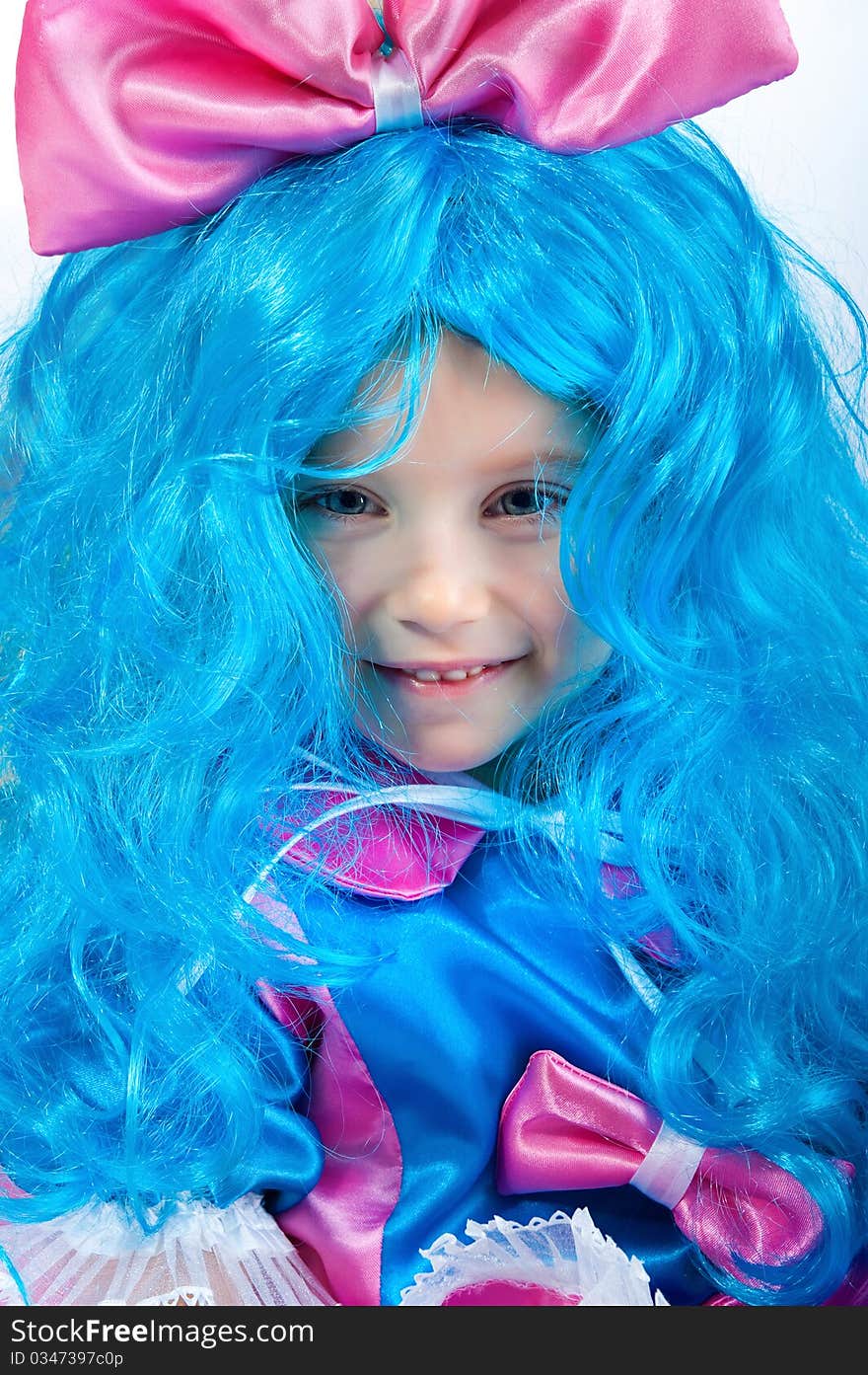 Little girl with blue hair close-up on white background. Little girl with blue hair close-up on white background