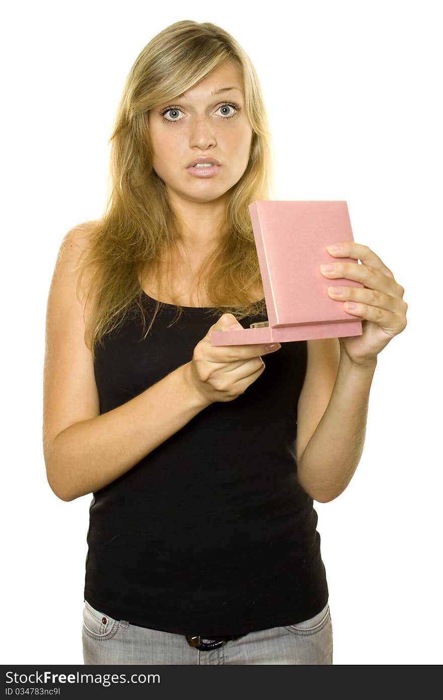 Bautiful young girl opens a gift box. Expressed surprise and shock. Isolated on white background. Bautiful young girl opens a gift box. Expressed surprise and shock. Isolated on white background