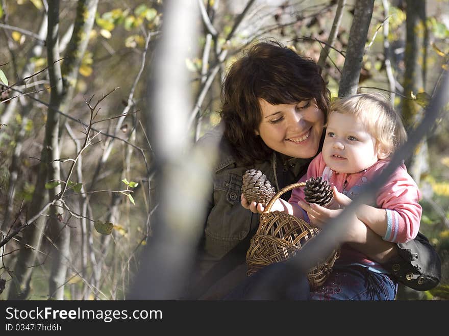 Mother and daughter playing outdoors. Mother and daughter playing outdoors