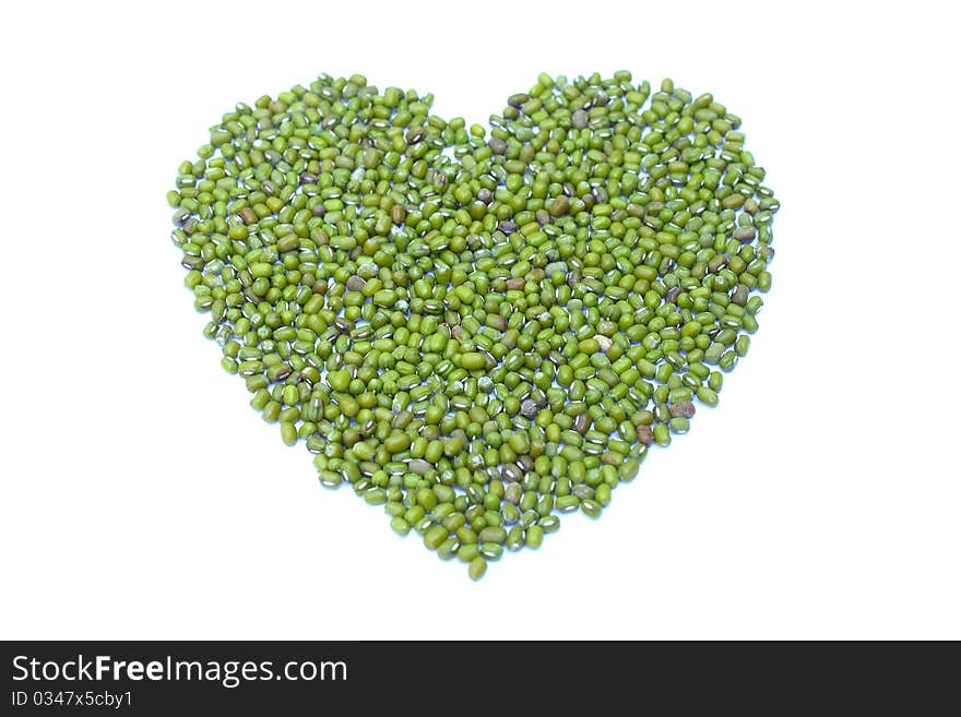 Green heart  from green nut on white background