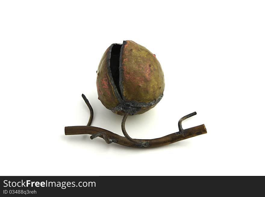 A metal forged open chestnut decoration with short branch on white background. A metal forged open chestnut decoration with short branch on white background