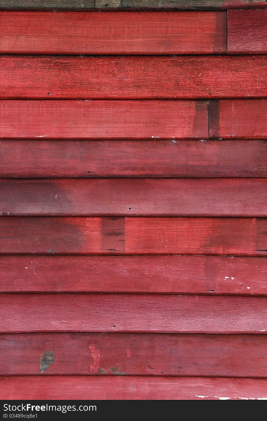 Old wood wall and chipping red color