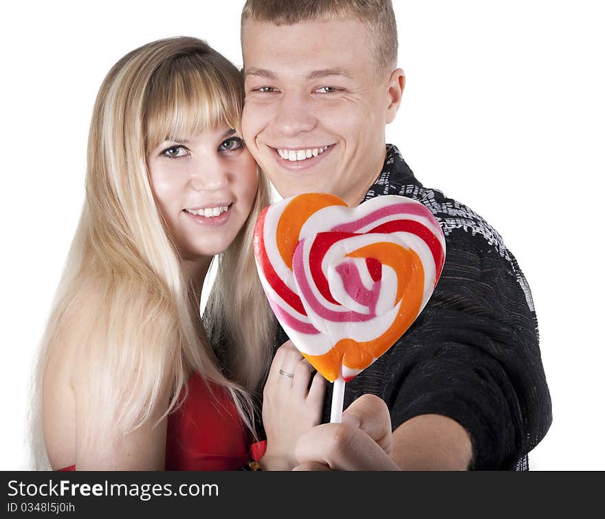 Loving couple with heart in hands on a white background