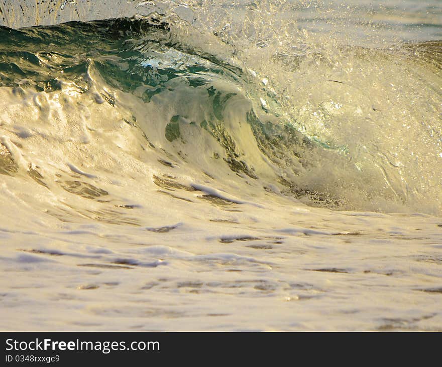 Clear water wave crashing in Hawaii