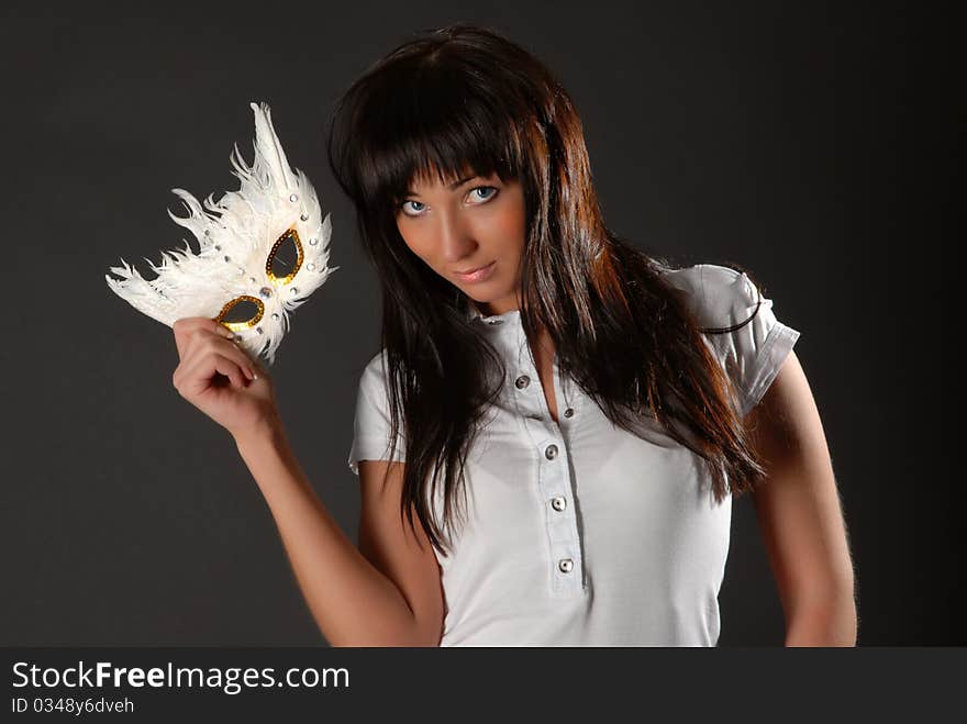 Brunette in a carnival mask. Brunette in a carnival mask