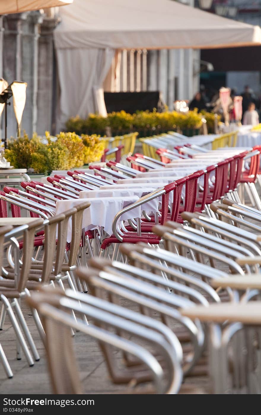 Outdoor cafe with red chairs