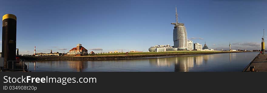 180 degree panorama image taken at the Bremerhaven harbor, showing the four-star Atlantic Hotel Sail City and the surroundings. 180 degree panorama image taken at the Bremerhaven harbor, showing the four-star Atlantic Hotel Sail City and the surroundings