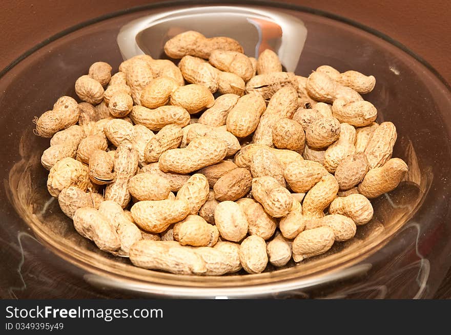 Peanuts on transparently glass plate. Peanuts on transparently glass plate