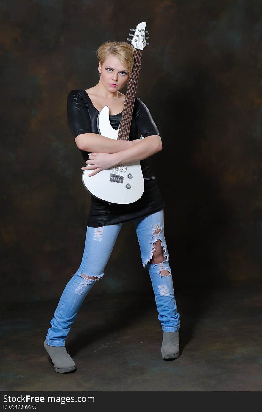 Pretty young female with guitar