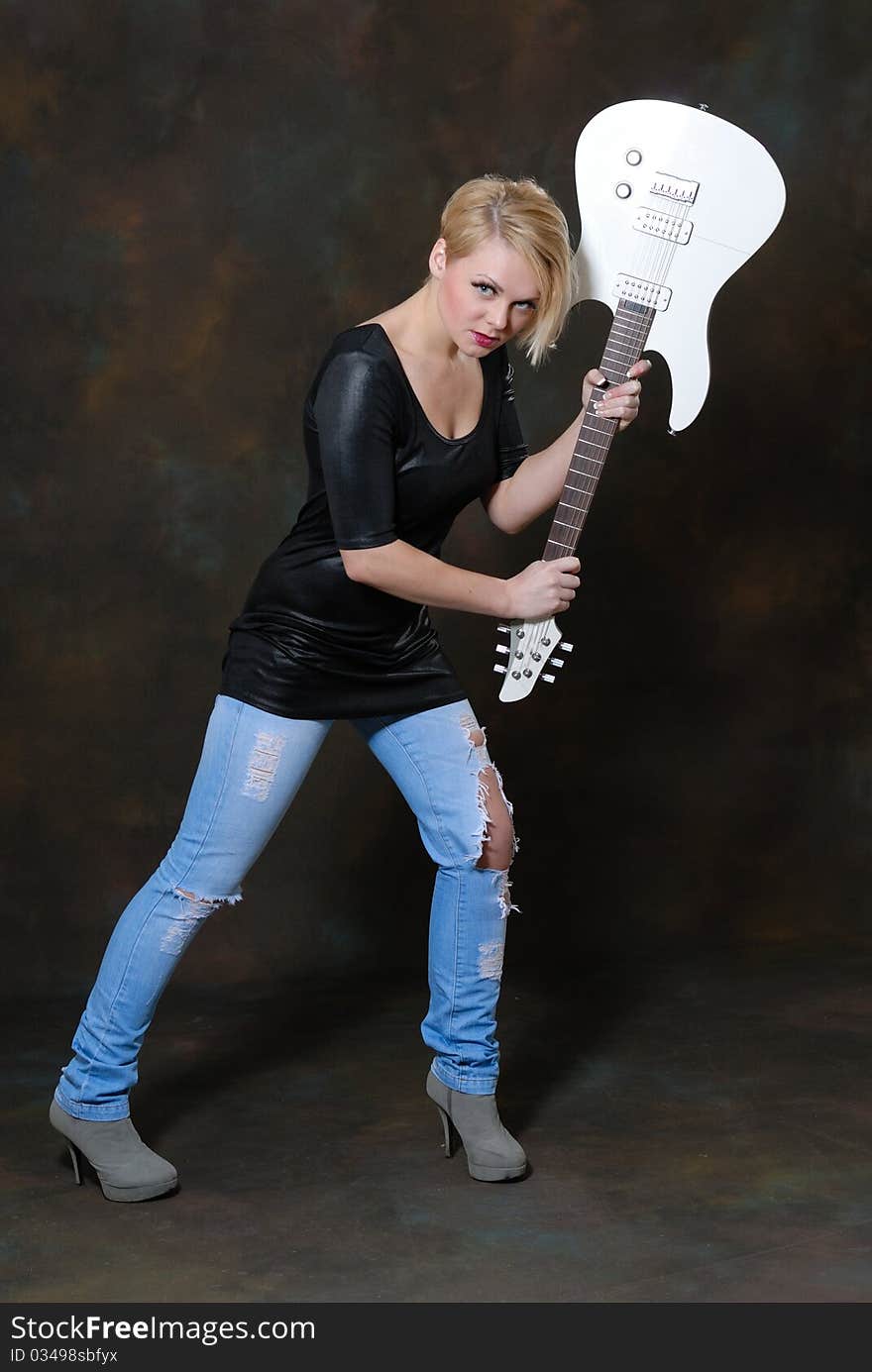 Pretty young female with guitar