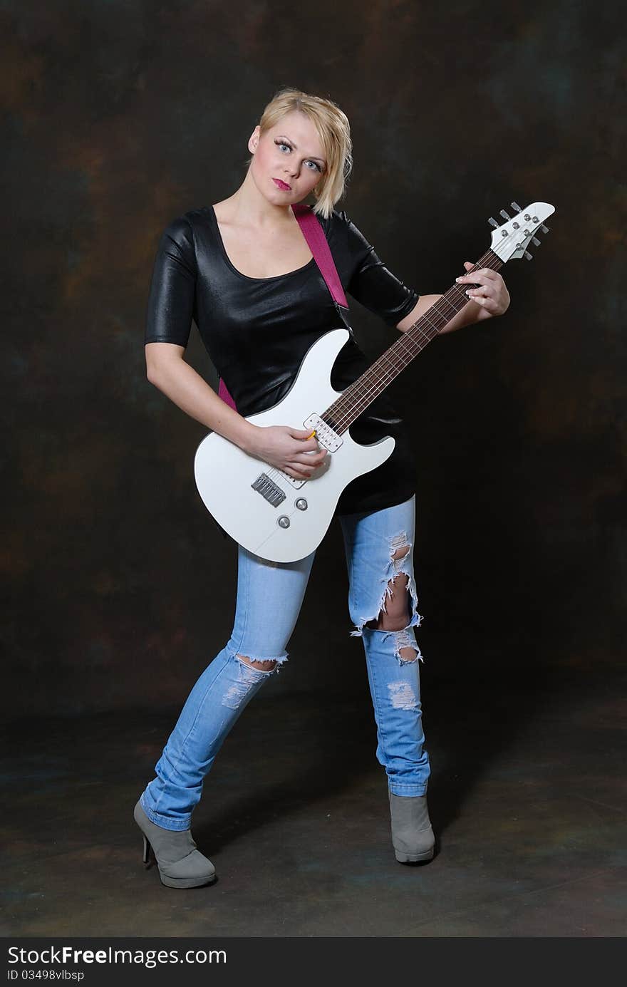 Pretty young female with guitar