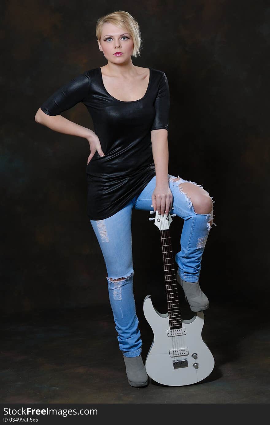 Pretty young female with guitar