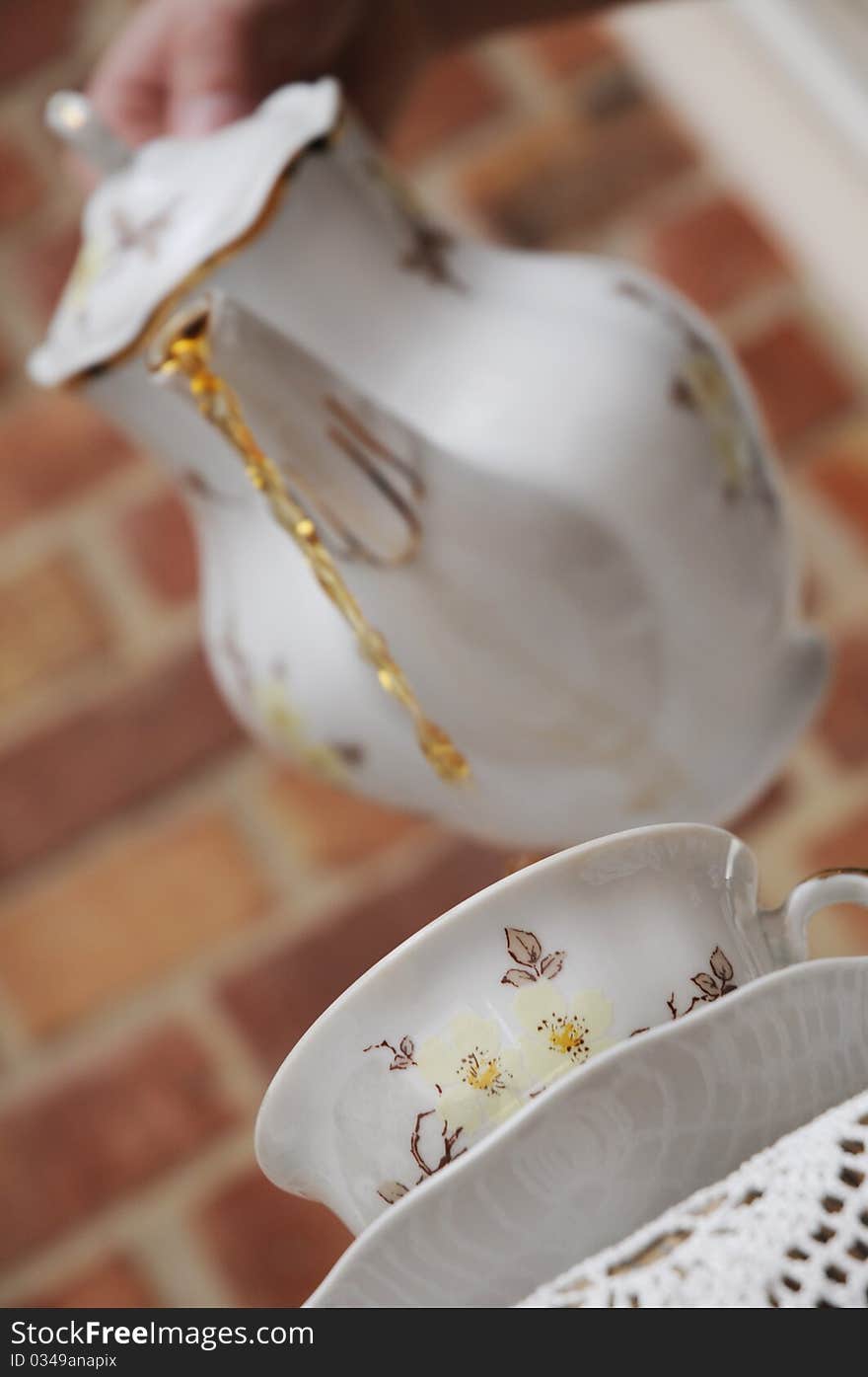 Porcelain jug and elegant cup.