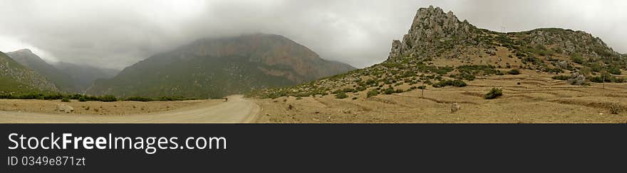 Panoramic view of Rif Mountains with a cloudy sky near Oued Laou, Chefchaouen, Morocco. Panoramic view of Rif Mountains with a cloudy sky near Oued Laou, Chefchaouen, Morocco