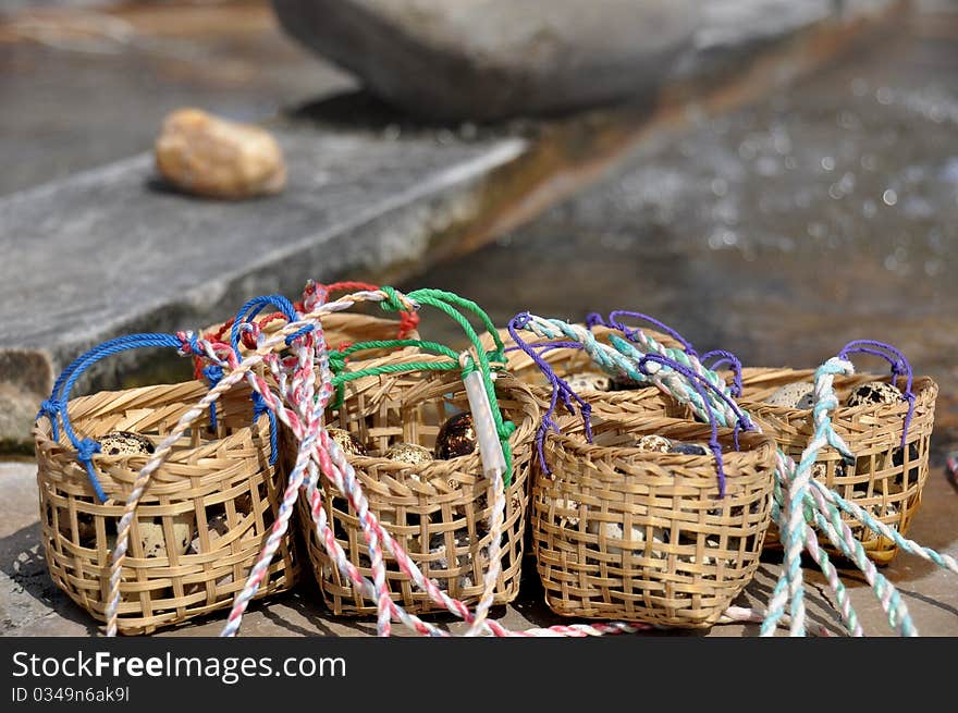 Baskets of eggs waiting to be boiled at hot spring