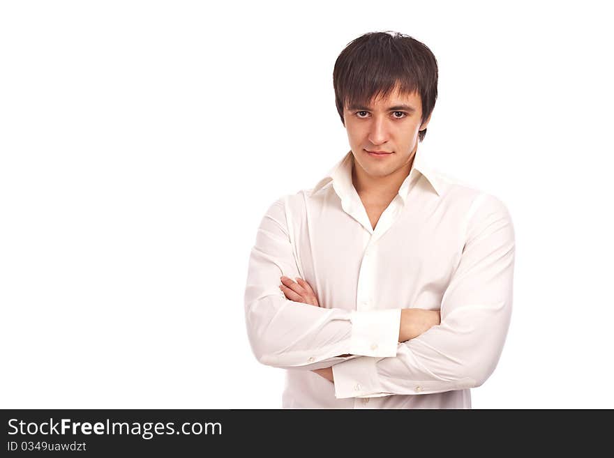 The serious guy in a white shirt on a white background. The serious guy in a white shirt on a white background