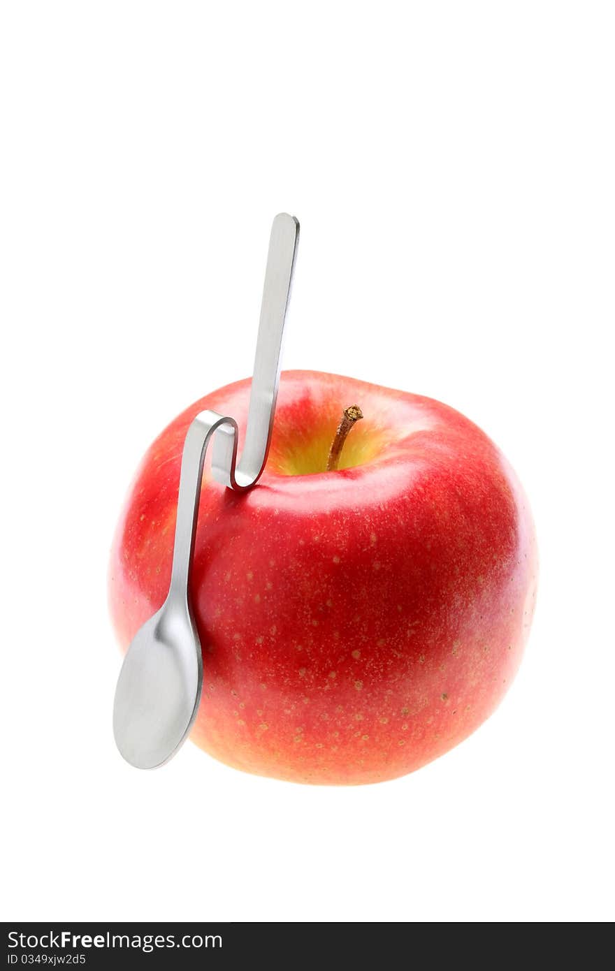 Apple and spoon