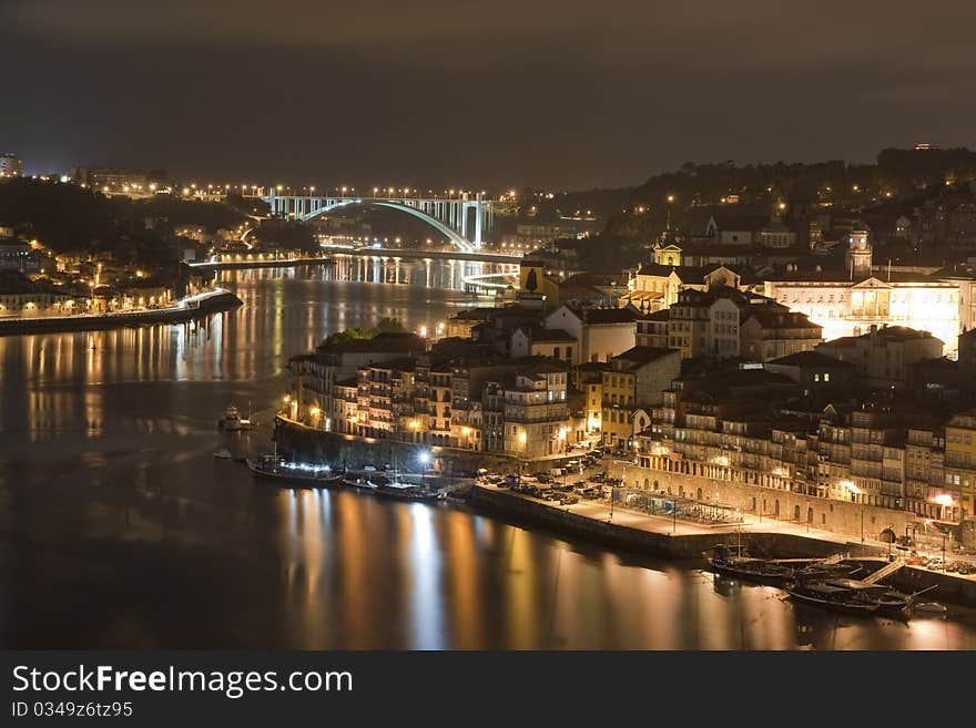 Oporto Portugal by night. 
Douro river and the Arrábida Bridge. Oporto Portugal by night. 
Douro river and the Arrábida Bridge.