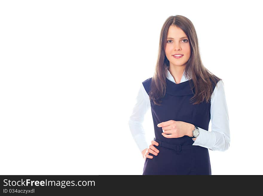 Beautiful European young businesswoman standing with hands folded against white background