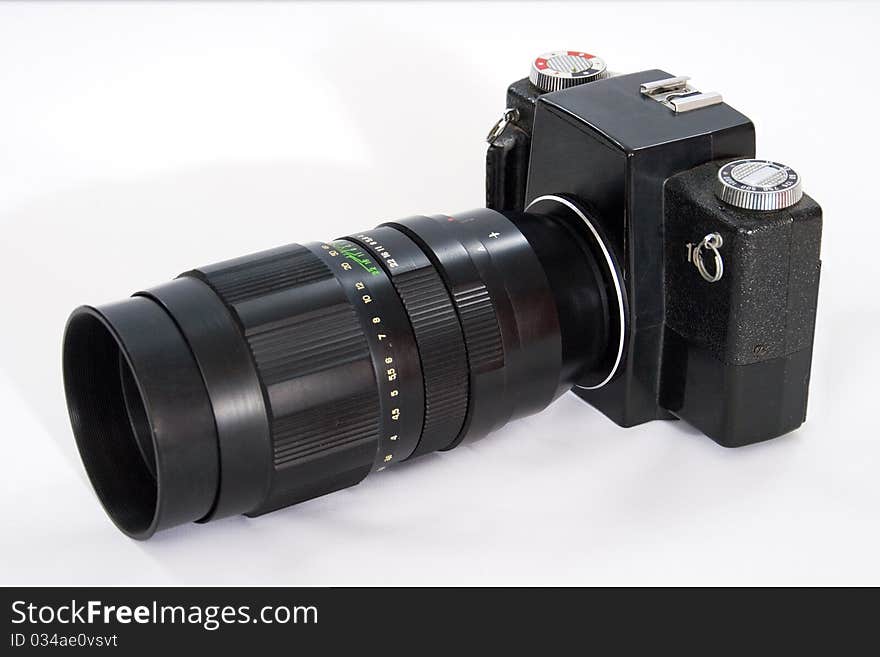 Black SLR camera with a large telescopic lens. 35mm. Black SLR camera with a large telescopic lens. 35mm